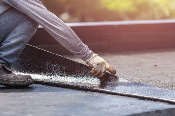 Professional Basement Waterproofing technician working in Rossville, TN